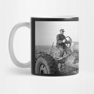 Farmer Driving Tractor, 1937. Vintage Photo Mug